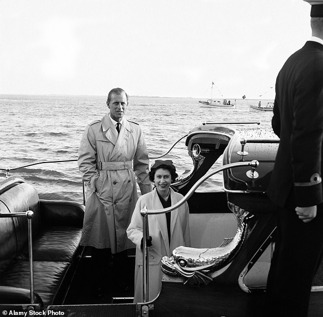 The royal couple pose after reuniting in Portugal. Philip had been away for four months