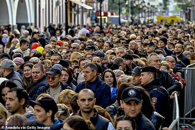 Moldovan citizens living in Moscow are seen queuing to vote at a polling station during the 2024 Moldovan elections in Russia