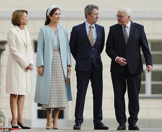 Mary turned heads alongside her husband King Frederik (both in the centre) as they were welcomed by German President Frank-Walter Steinmeier and the First Lady Elke Büdenbender