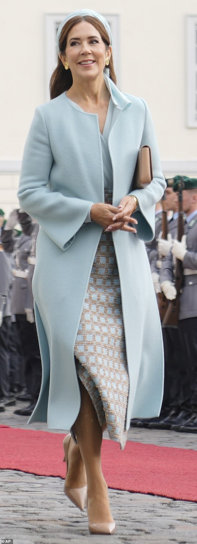 Mary looked elegant in a powder blue outfit, which consisted of soft, longline coat and matching blouse by Jesper Hovring