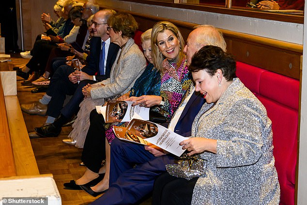 Máxima wore her long, blond hair in a classic blow-dry for the event and brightened her complexion with golden bronzer and a slick of berry-coloured lipstick