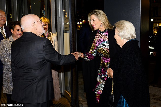 Máxima appeared especially animated as she greeted Ton Koopman (right) who the Dutch royals were in Utrecht to celebrate