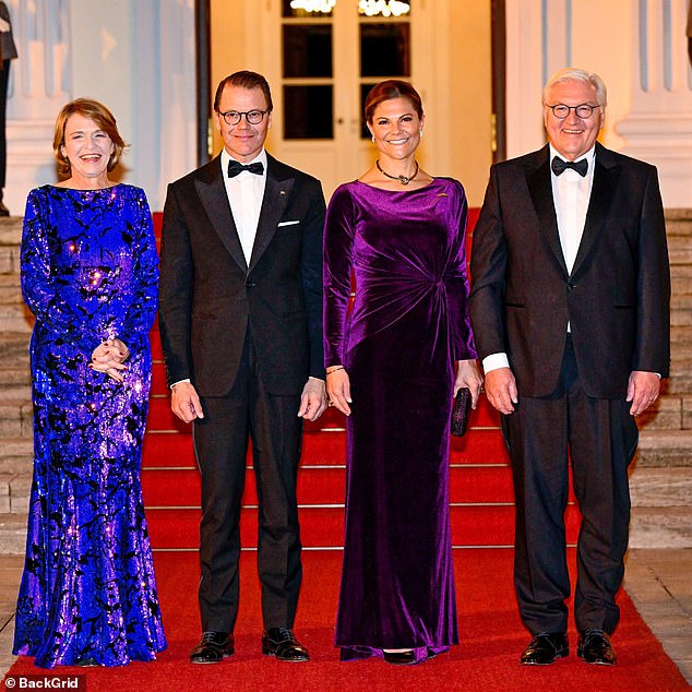 Victoria (centre-right) kept her makeup looking natural, with just a hint of eyeliner and a sweep of blush over her flawless base.