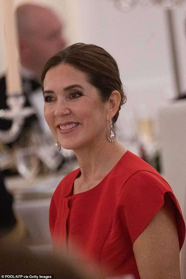 Queen Mary of Denmark paired her striking red gown with a pair of diamond drop earrings