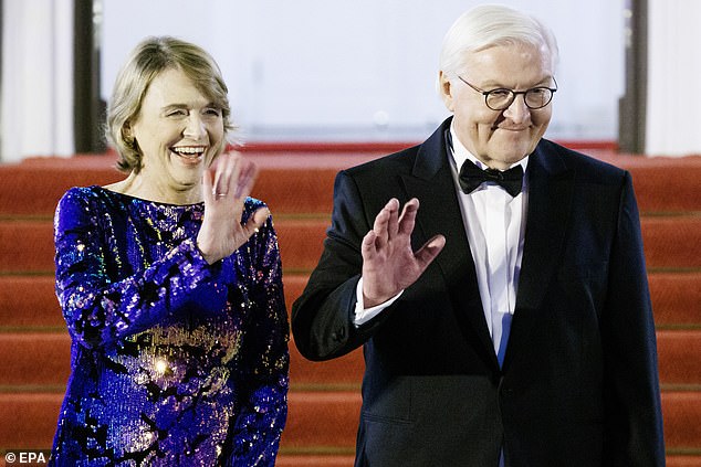 German President Frank-Walter Steinmeier (R) and his wife Elke Buedenbender wave during arrivals at the dinner hosted to celebrate the 25th anniversary of the Nordic Embassies