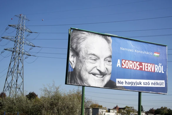 A billboard with a poster of Hungarian-American billionaire and philanthropist George Soros with the lettering "National consultation about the Soros' plan - Don't let it pass without any words" is seen in the 22nd district of Budapest on October 16, 2017 (Photo by ATTILA KISBENEDEK / AFP) (Photo by ATTILA KISBENEDEK/AFP via Getty Images)