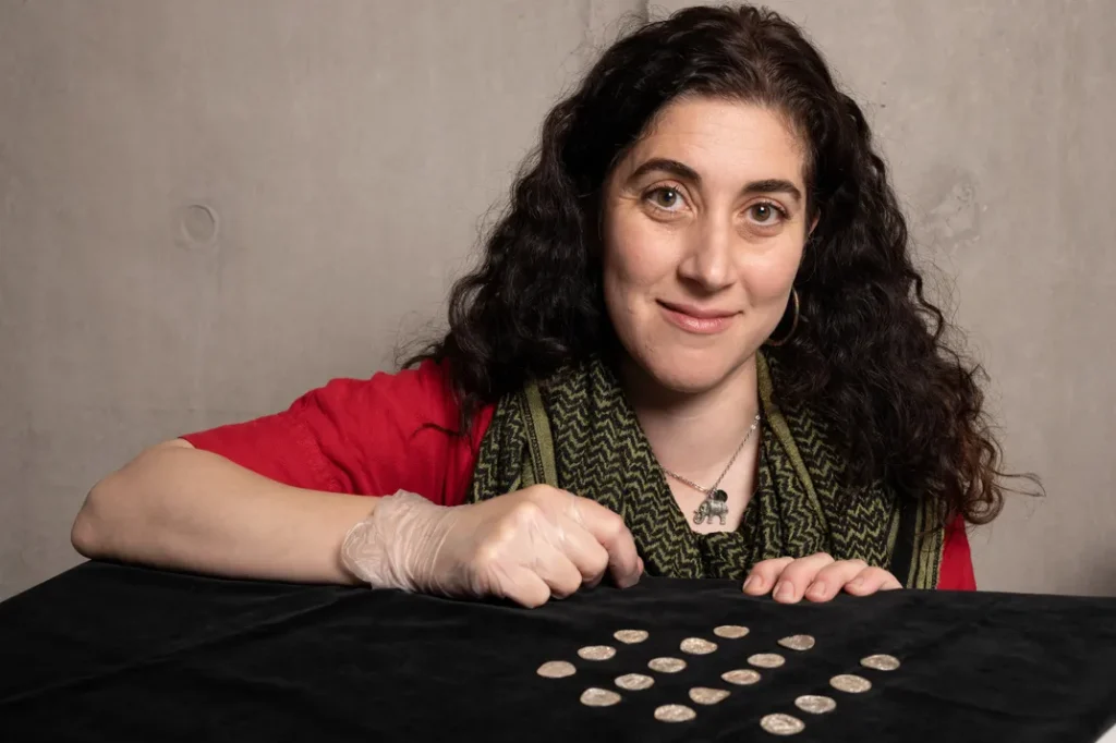 Amal Khreisheh, curator of archaeology at the South West Heritage Trust, with some of the conserved coins. Photo: British Museum