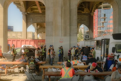 Workers on a break at the Senakw construction site.