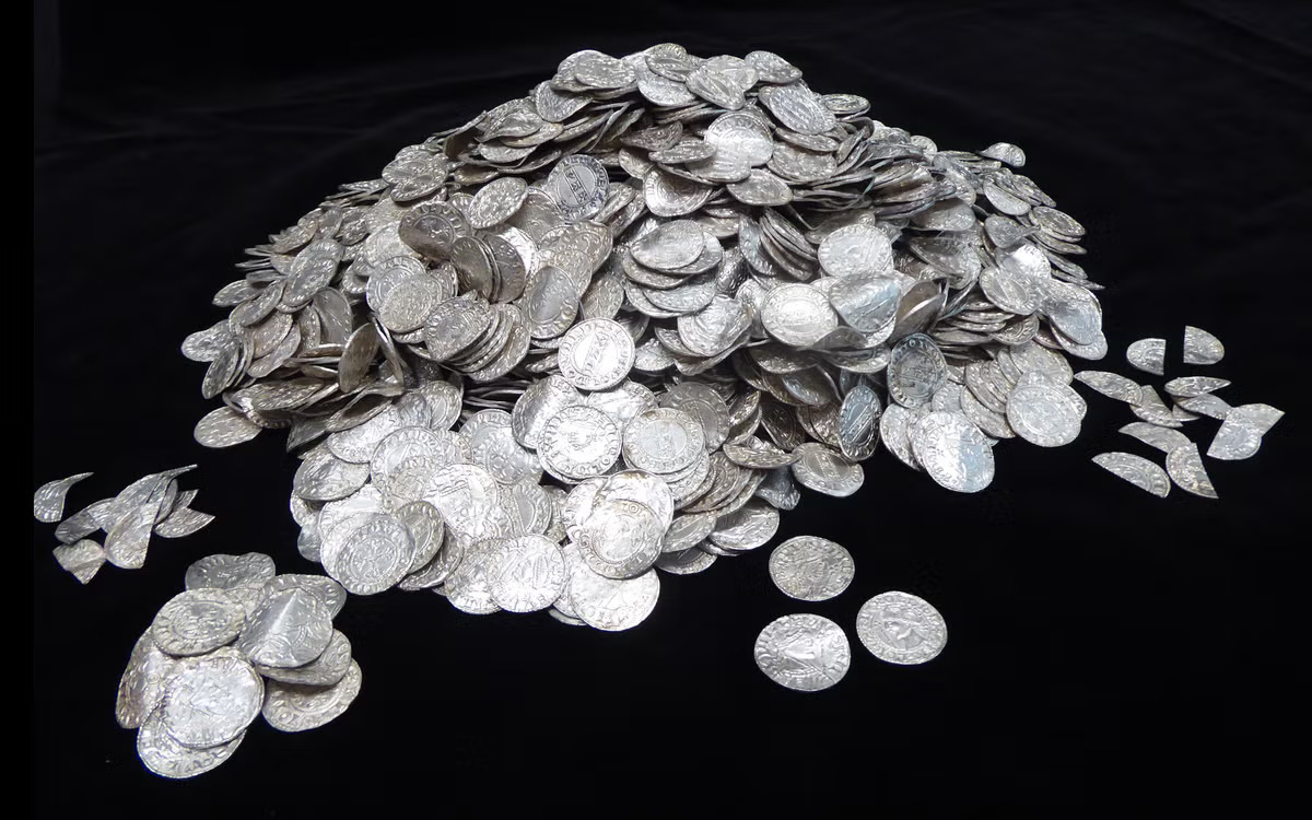 Seven metal detectorists found 2,584 silver coins in a southwest England field "the most expensive treasure ever found in the United Kingdom"