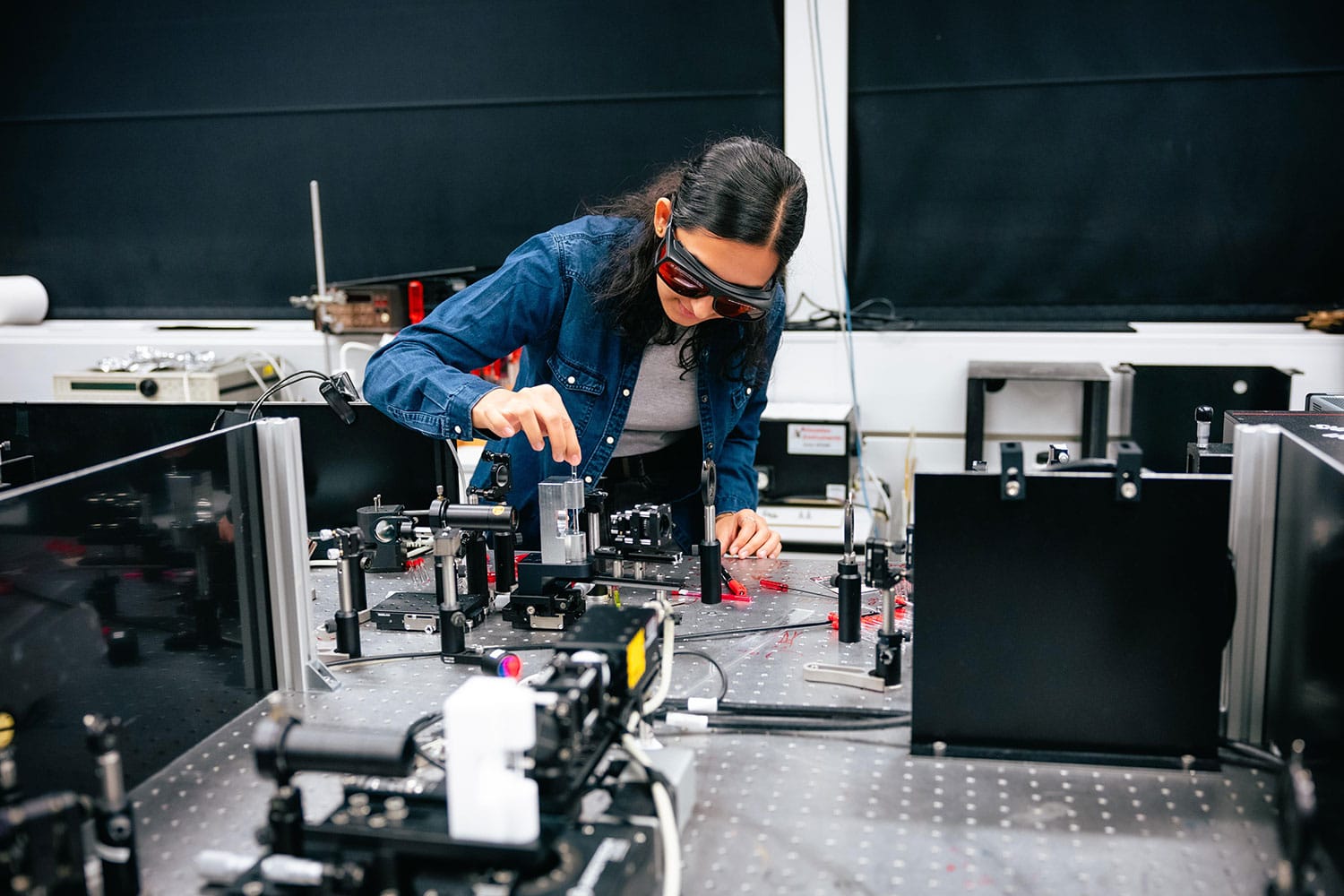 PhD student Eksha Chaudhary with the correlated vibrational spectroscopy setup. Credit: Jamani Caillet