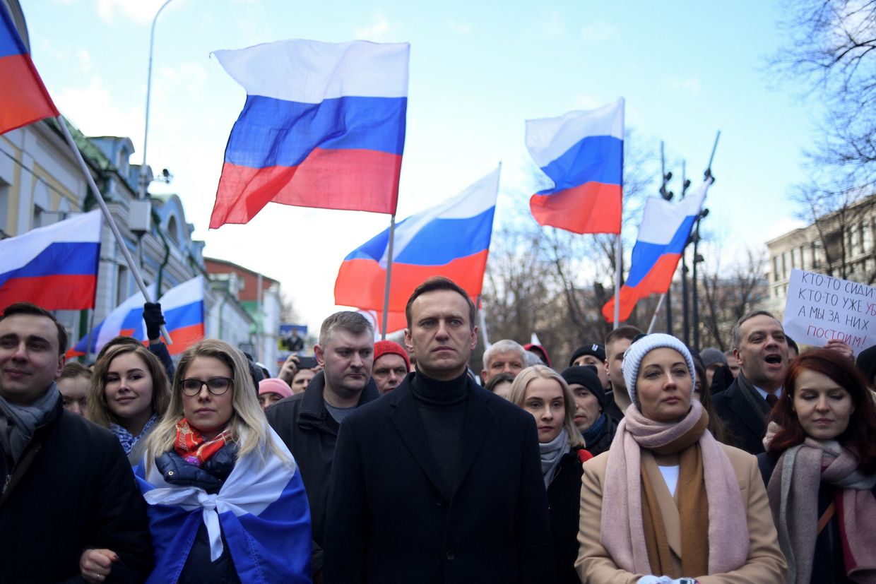 Russian opposition leader Alexei Navalny, his wife Yulia, politician Lyubov Sobol, and others march in memory of Boris Nemtsov in Moscow on Feb. 29, 2020.