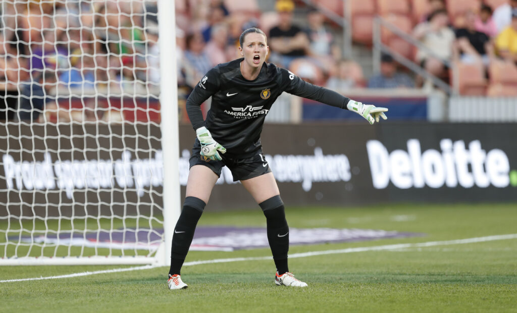 Utah Royals goalkeeper Mandy Haught yells instructions during a match.