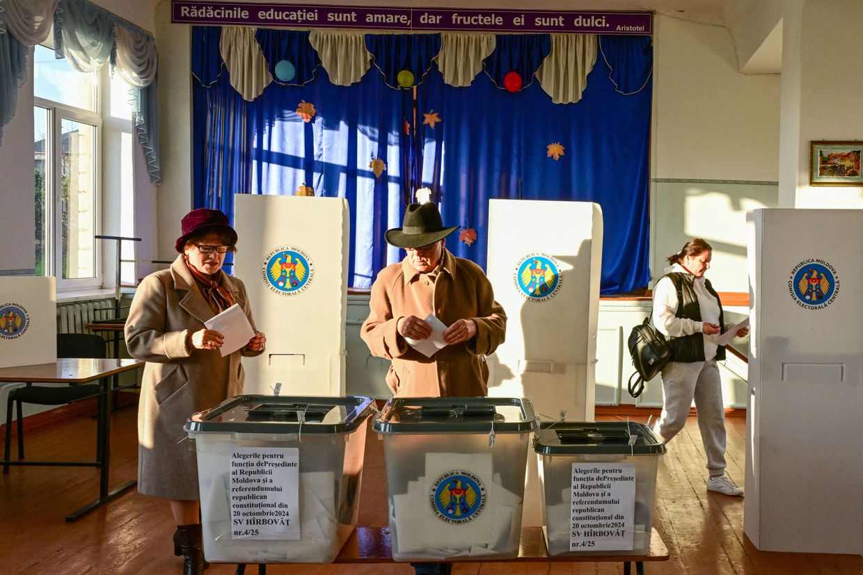 People vote in the presidential elections and EU referendum at a polling station in Hirbovat, Moldova, on Oct. 20, 2024.