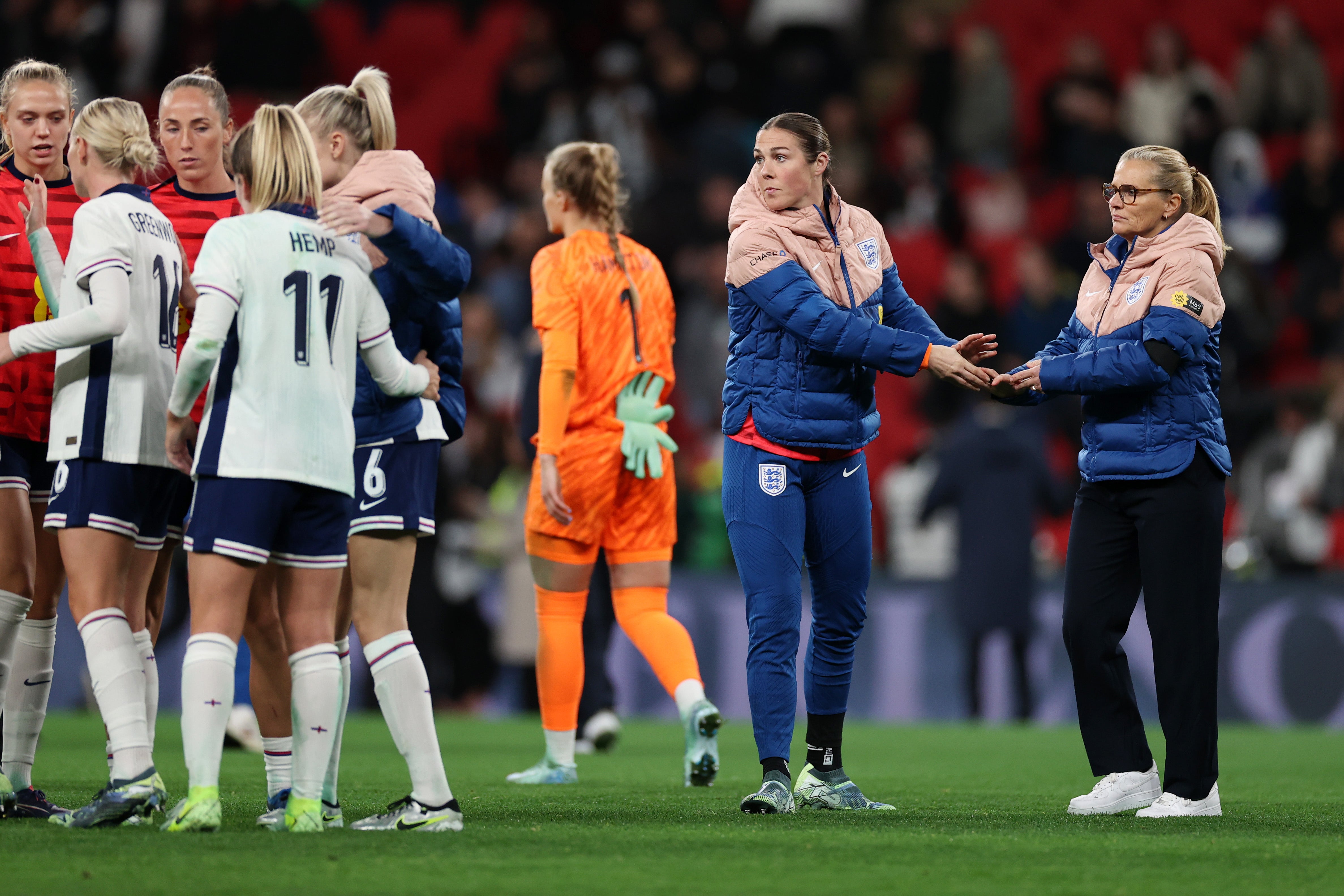 It was a disappointing night for England manager Sarina Wiegman, far right