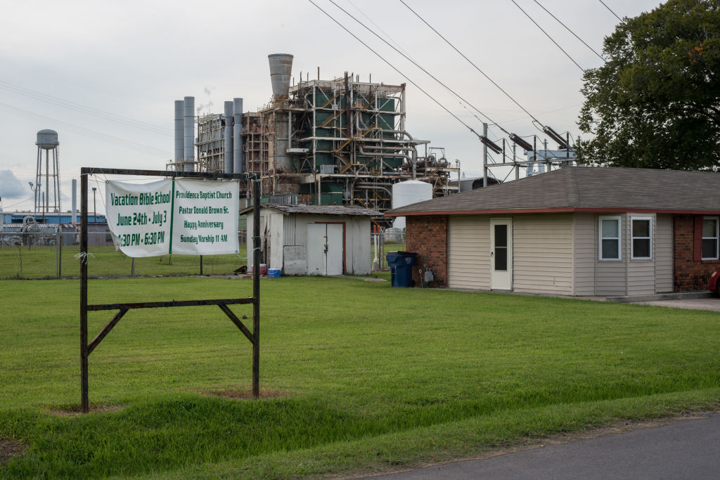 A house sits along the long stretch of River Road by the Mississippi River and the many chemical plants October 12, 2013. 'Cancer Alley' is one of the most polluted areas of the United States and lies along the once pristine Mississippi River that stretches some 80 miles from New Orleans to Baton Rouge, where a dense concentration of oil refineries, petrochemical plants, and other chemical industries reside alongside suburban homes.