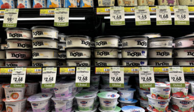 grocery store shelves full of yogurt packages