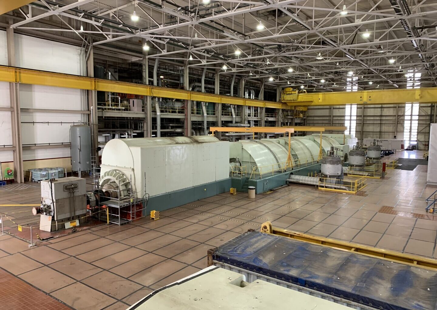 When operational, steam pushes through four turbines, turning a shaft in the generator at the front of the room to create electricity. The turbine hall at Three Mile Island Unit 1 is seen here on Oct. 16, 2024.