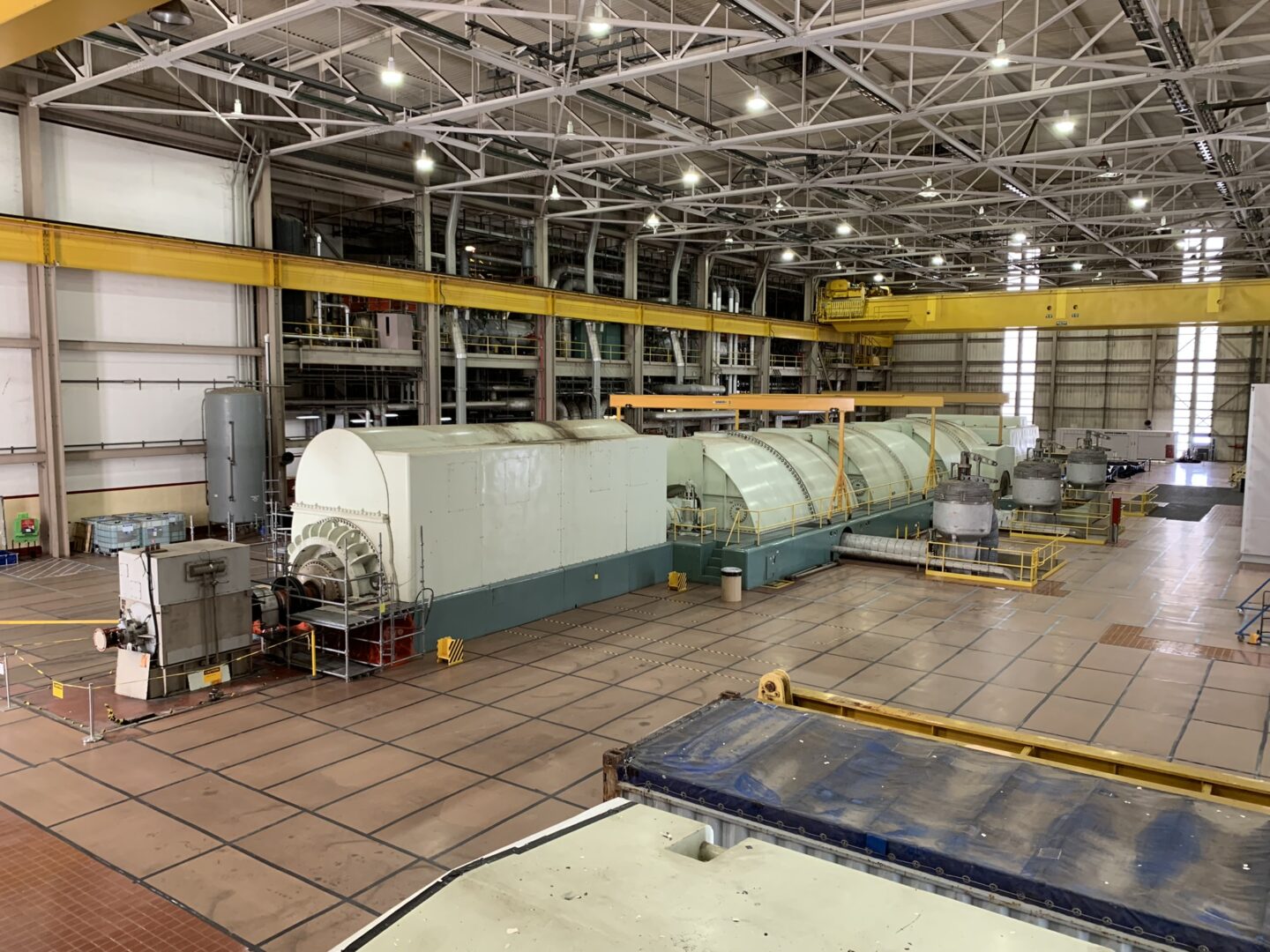 When operational, steam pushes through four turbines, turning a shaft in the generator at the front of the room to create electricity. The turbine hall at Three Mile Island Unit 1 is seen here on Oct. 16, 2024.