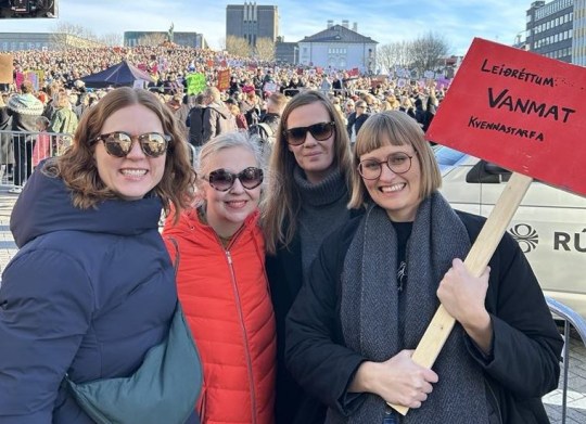 Finnborg holding a red sign at the 2023 Women's Day Off