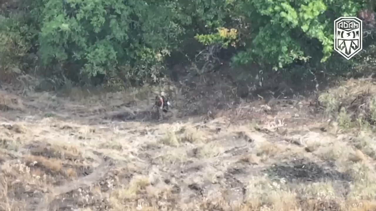 Footage of a Ukrainian kamikaze drone hunting a lost Russian soldier. Combat work drone operators of the "Adam" tactical group. Music and emojis from source.