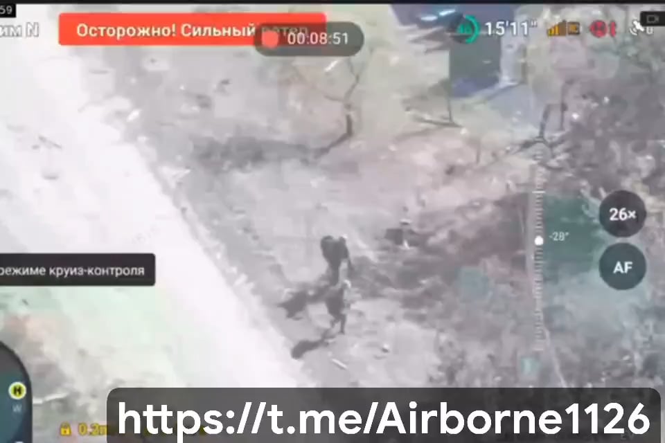 Drone footage of two Russian soldiers trying to defuse a Ukrainian IED.