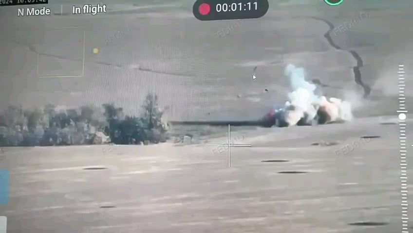 A hit on a Russian armored personnel vehicle sends a crew member into the air