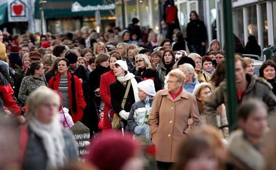 Icelandic women walk through a city centre 