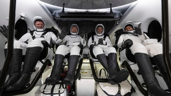 This photo provided by NASA shows Roscosmos cosmonaut Alexander Grebenkin, left, NASA astronauts Michael Barratt, second from left, Matthew Dominick, second from right, and Jeanette Epps, right, inside the SpaceX Dragon Endeavour spacecraft onboard the SpaceX recovery ship MEGAN shortly after having landed in the Gulf of Mexico off the coast of Pensacola, Florida, Friday, Oct. 25, 2024.(AP)