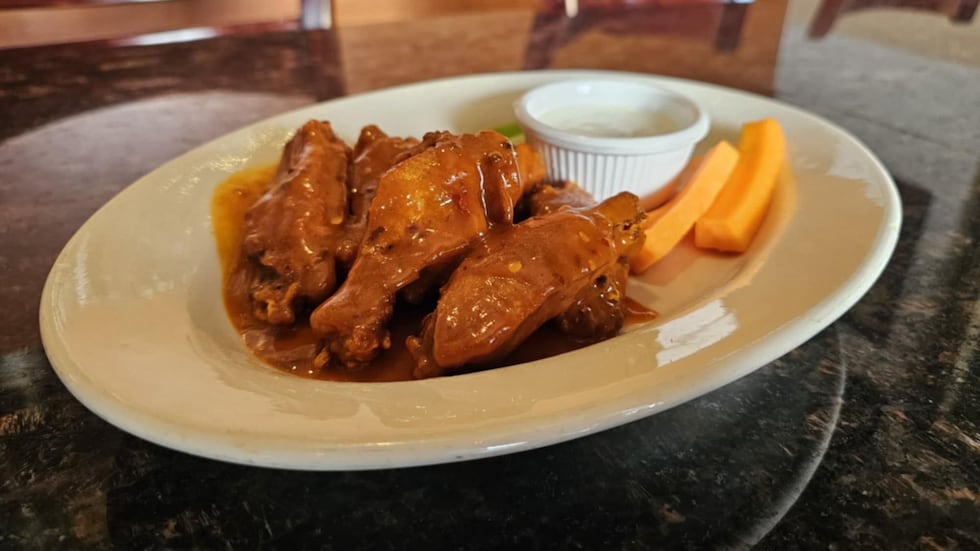 The spicy buffalo wings can be ordered by the dozen or half dozen and come with buffalo, mild...