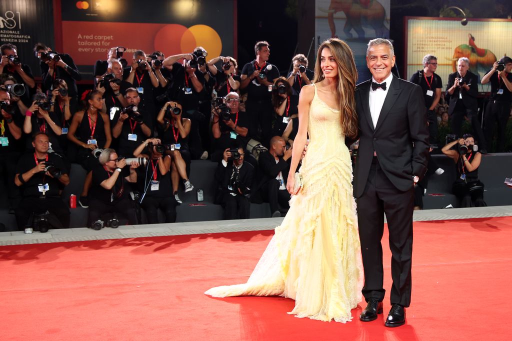 Amal Clooney and George Clooney attend the "Wolfs" red carpet during the 81st Venice International Film Festival on September 01, 2024 in Venice, Italy.