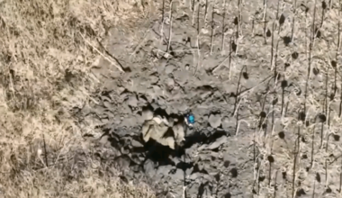 RU POV: A Russian soldier lying in a crater is shocked by a FPVdrone strike that did not detonate