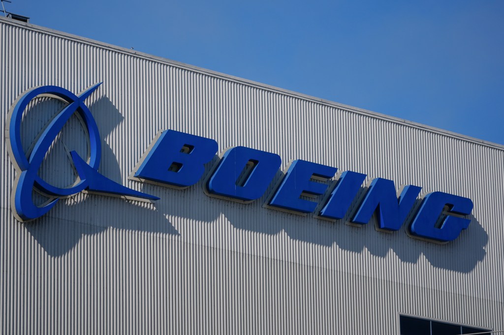 Boeing logo displayed on the company's factory building in Renton, Washington