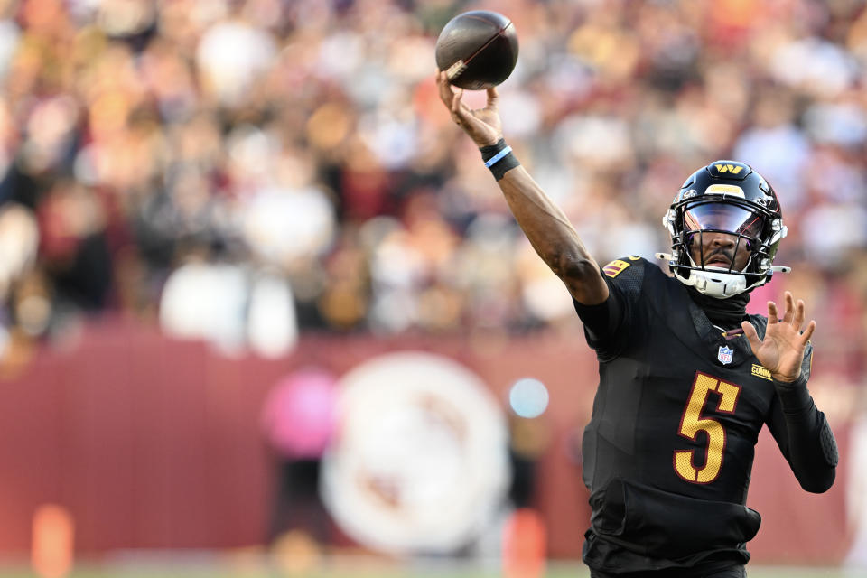 Jayden Daniels completed a Hail Mary with no time left to beat the Chicago Bears. (Photo by Greg Fiume/Getty Images)