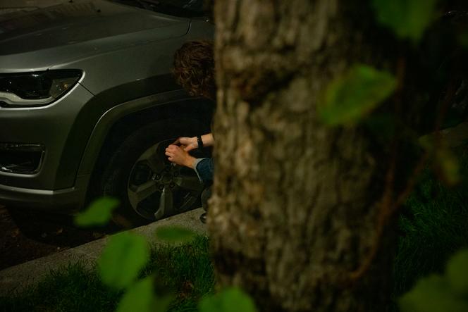 A small group of climate activists conduct an operation, deflating SUV tires to denounce the use of excessively polluting vehicles, in Paris, in November 2022.