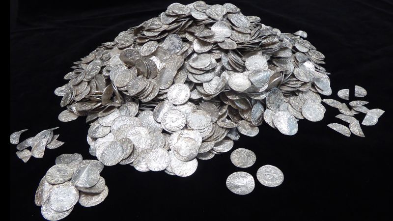 Hoard of silver coins dating from Norman Conquest is Britain’s most valuable treasure find ever