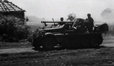 Sd.Kfz. 10 half-track field modified with a 5cm Pak 38 anti-tank gun engaging a Soviet T-34/76 tank on the Eastern Front in 1943