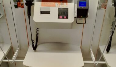 The Migros at Cornavin has warnings that bags are paid at some of the self-checkout stations but not all of them