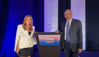 Mira Farka, left, and Anil Puri, pose at a podium at the 30th Annual Economic Forecast Conference on Oct. 24