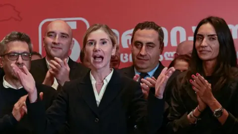 VANO SHLAMOV/AFP Tina Bokuchava, the chair of the United National Movement opposition party, gives a speech during a gathering at the party's headquarters after exit polls were announced during parliamentary elections in Tbilisi on October 26, 2024