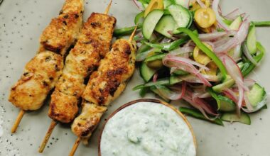 Greek style marinated chicken kabobs, salad and tzatziki lo