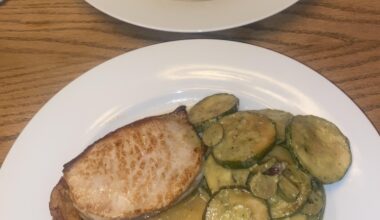 pork chops, pesto braised courgette, roast potatoes, pork jus