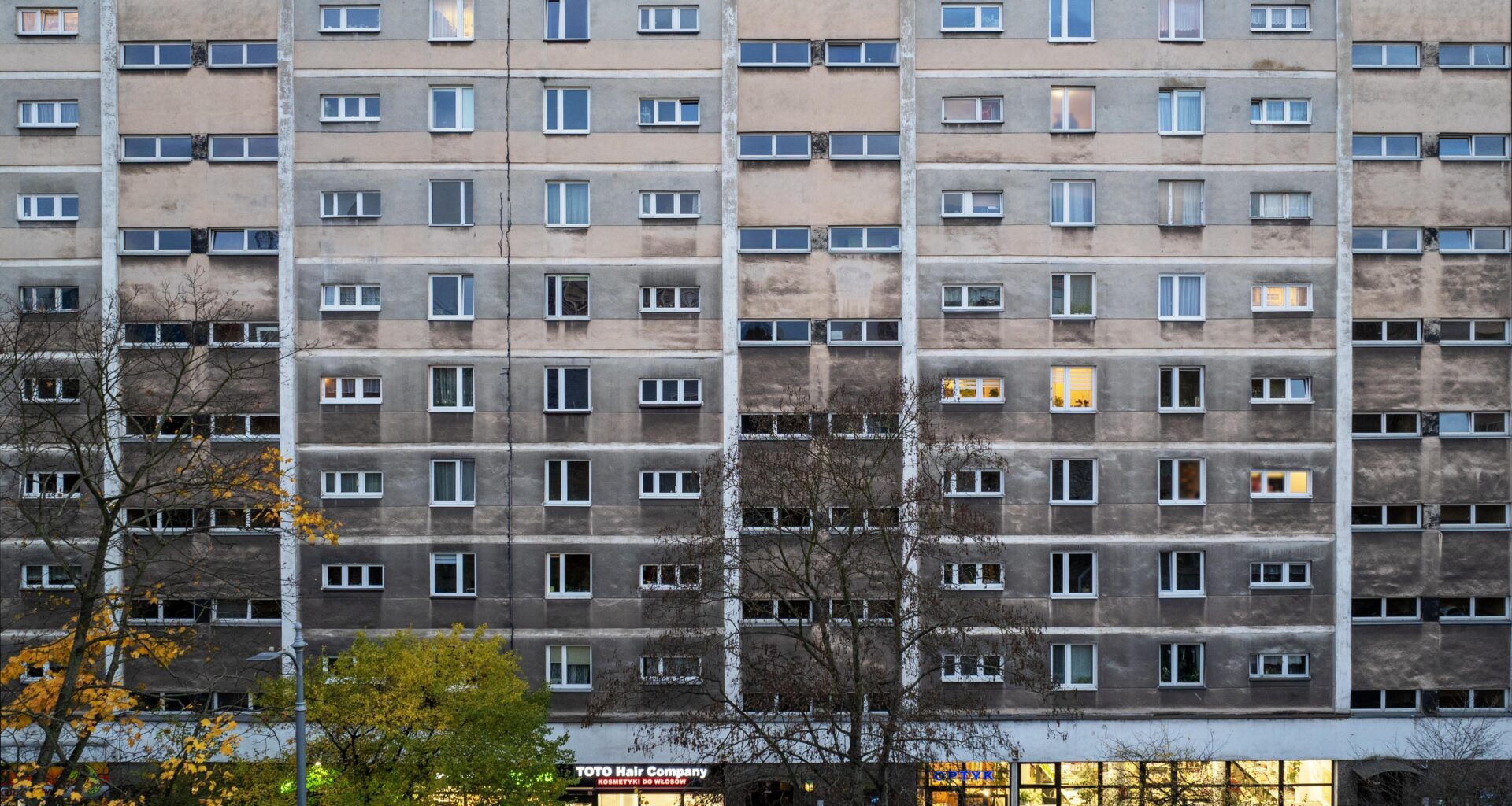 A residential building in Krakow with a darkened facade, showing the effects of air pollution