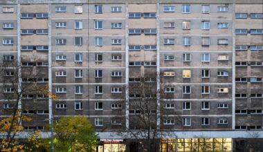 A residential building in Krakow with a darkened facade, showing the effects of air pollution