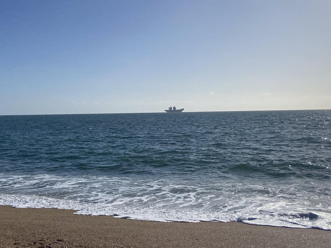 Aircraft carrier just off the beach in Devon