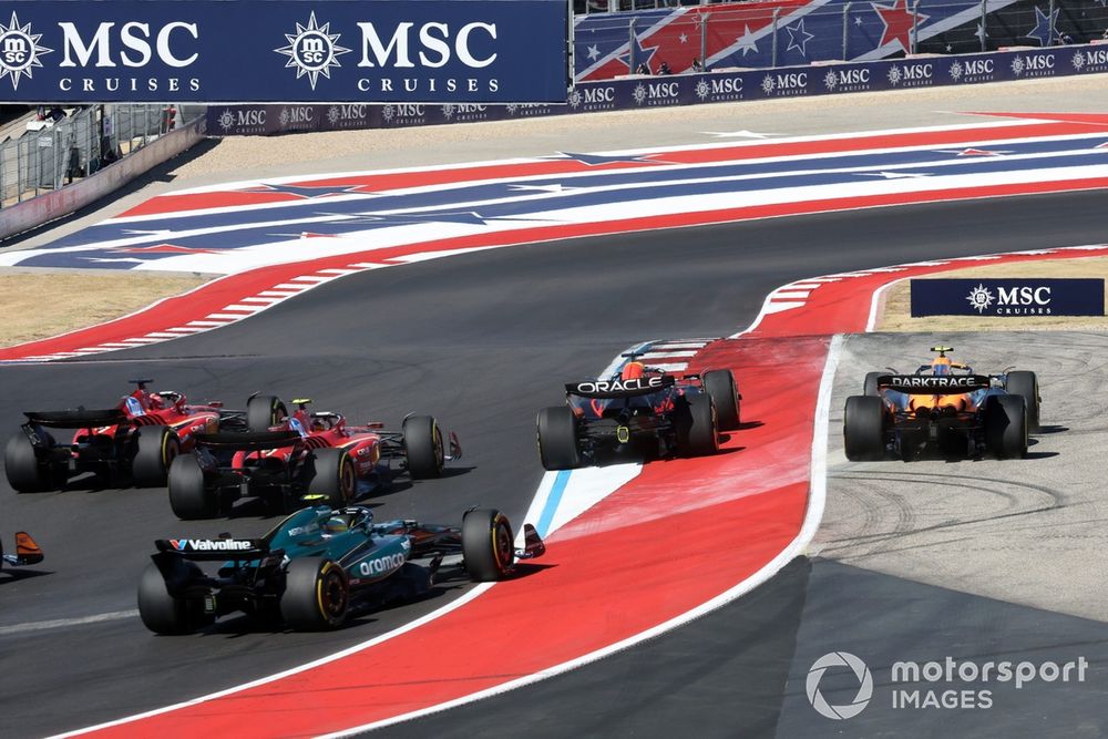 Max Verstappen, Red Bull Racing RB20, Lando Norris, McLaren MCL38, battle into turn 1, as Charles Leclerc, Ferrari SF-24 overtakes Carlos Sainz, Ferrari SF-24 