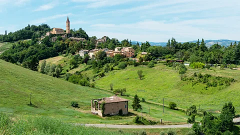 Getty Images Apart from tortellini, Italy's beautiful Emilia-Romagna is the birthplace of many iconic Italian foods, like Parma ham and Parmigiano-Reggiano cheese (Credit: Getty Images)