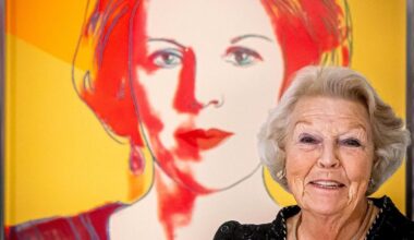 Queen Beatrix Of The Netherlands with her portrait by Andy Warhol