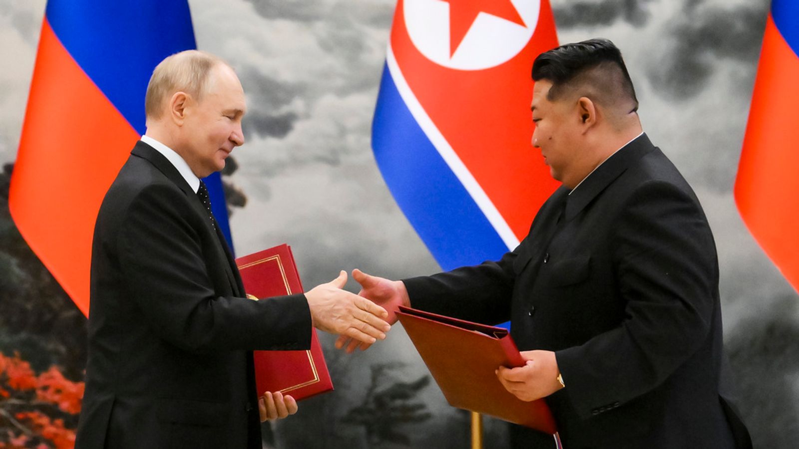 Russian President Vladimir Putin, left, and North Korea's leader Kim Jong Un. Pic: AP