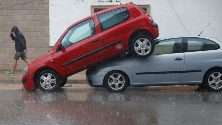 A car sits partially on top of another after the Spanish meteorological agency put the Valencia region in the highest red alert for extreme rainfalls, in Llombai, Valencia, Spain, October 29, 2024. REUTERS/Eva Manez
