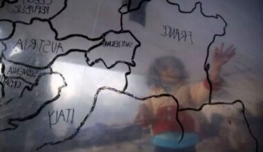 A refugee child looks at a map of Europe inside a makeshift tent at a refugee camp near the registration center on the Greek island of Lesbos - March 23, 2016 (Reuters)